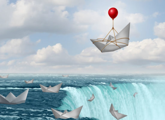 A balloon rescuing a paper boat from a waterfall